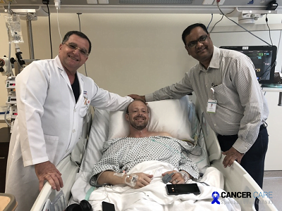 Dr Sadir & Dr Arun with a survivor