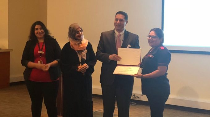 Fouzia Lucas manager of the oncology unit receiving recognition award from alzahra hospital Adminstrative August 2018 Dubai UAE